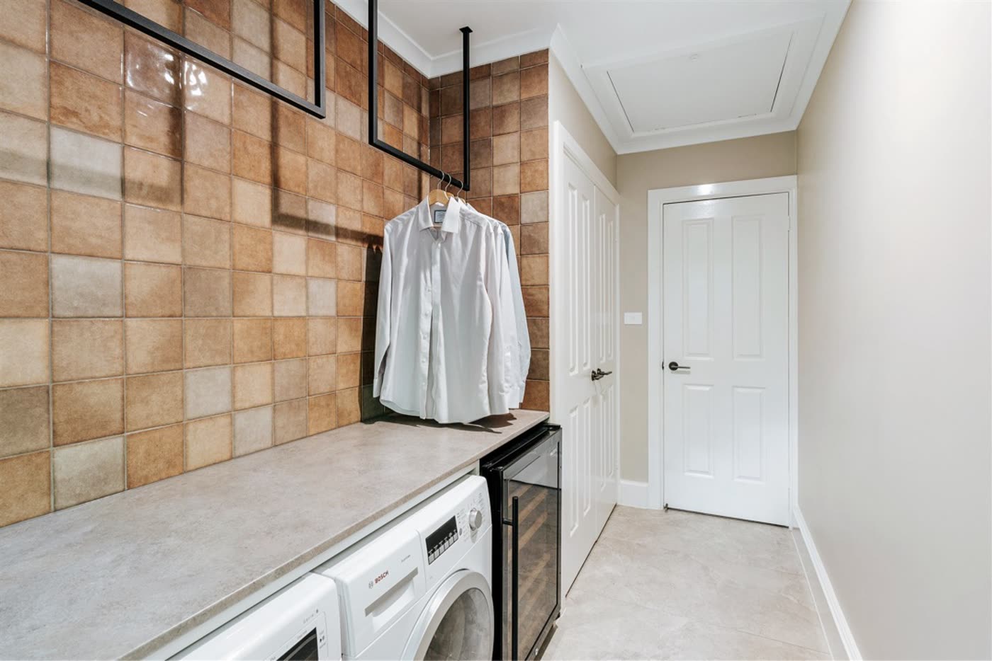 Griffith laundry with terracotta tile splashback