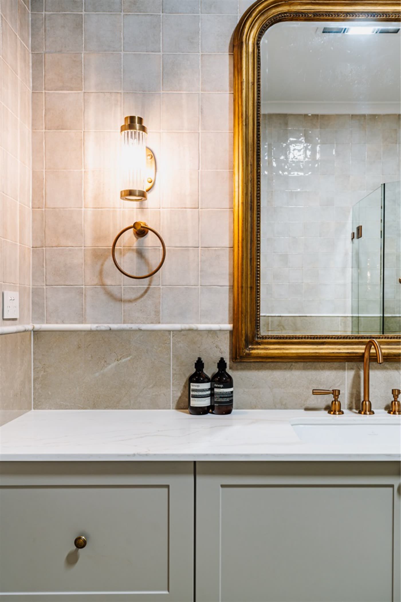 Griffith powder room with brass fittings and stone benchtop
