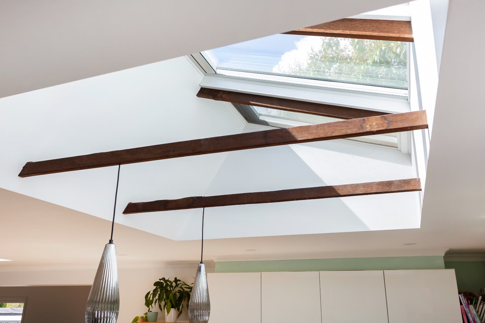 Holder living area with exposed timber beams and skylights